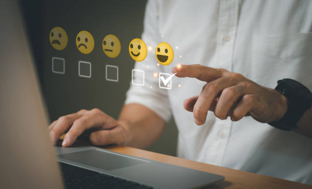 istock Selective focus at finger of business man while point finger to choose feedback on excellent customer service with five star score with smile. Service evaluation concept with futuristic icon. 1471110651