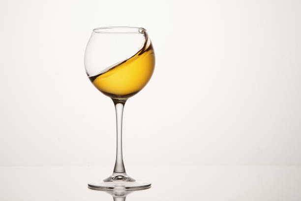 istock White wine diagonal wave, curl is in stemmed glass. 1471119532