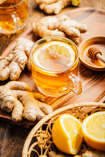 istock Ginger tea with lemon and honey on a wooden table 1471122603