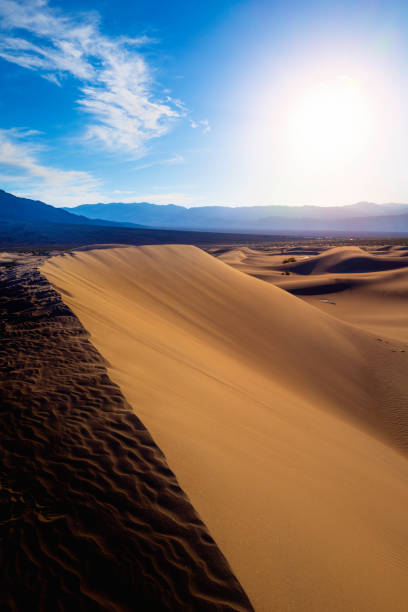 istock Mesquite Flat Sand Dunes, Death Valley desert hills, and sunset cloudscape in Nevada in winter 1471128558