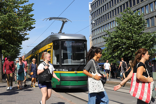 Helsinki, Finland - August 20, 2022: A Transtech Artic tram in service on line 4 with destination Katajanokka at the Lasipalatsi stop outside the Sokos department store.