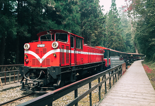 Banff, Canada -November 2019: Canadian Pacific train (CP Rail) passing through the famous Morant's Curve, located in Banff National Park, Alberta. The scene in featured on the $10 bill.