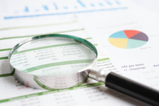 istock Magnifying glass on charts graphs paper. Financial development, Banking Account, Statistics, Investment Analytic research data economy. 1471134576