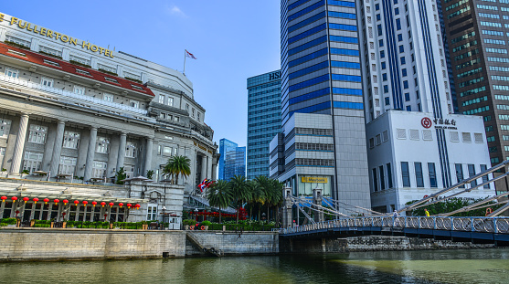 Singapore - Feb 9, 2018. Singapore River with skyscrapers. Singapore is a global commerce, finance and transport hub.