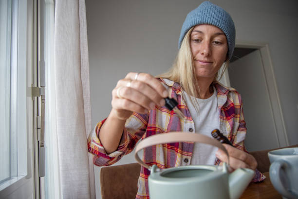 istock Woman using medical cannabis at home 1471138901