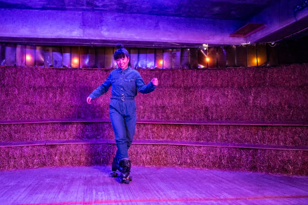 istock Late 30s Asian roller disco dancer in jumpsuit 1471143645
