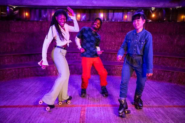 istock Asian and Black roller dancers together under neon lighting 1471143660