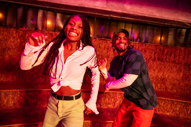 istock Young Black roller dancers skating in disco environment 1471143661