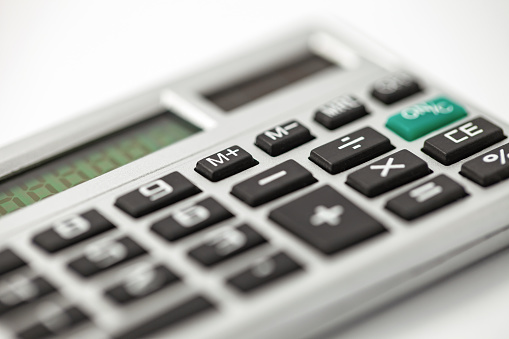 Calculator, silver device for financial calculations, side view, selective focus