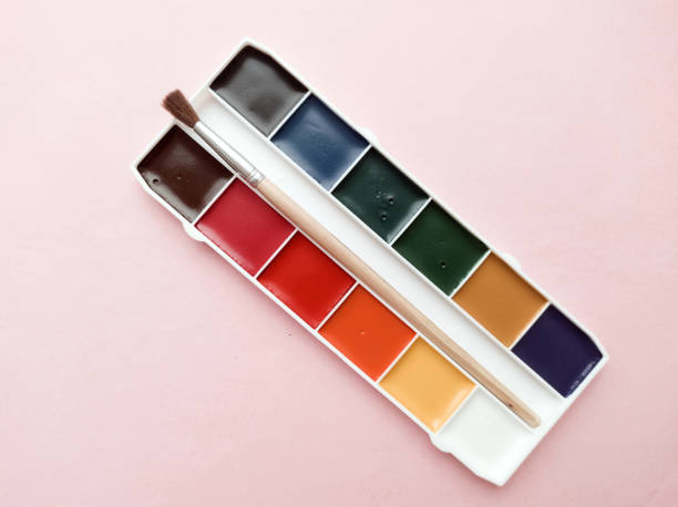 istock Brush and paint on a white background. Everything for drawing. Creation. Children is creativity. Hobby. Colored paints and gouache. 1471144467