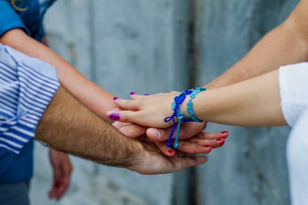 istock Group of friends unity oath with their hands 1471144534