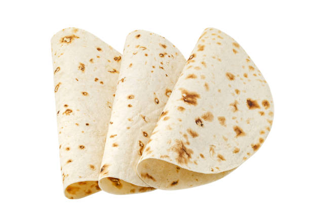 istock Pita bread cake, three pieces rolled in half, isolated on white background with clipping path 1471144645