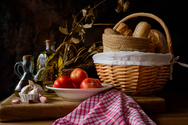 istock Still life with extra virgin olive oil, tomatoes, garlic and bread. 1471150792