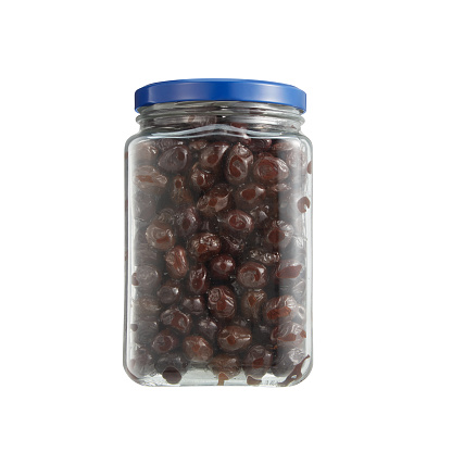 Glass Container Of Black Olives On White Background
