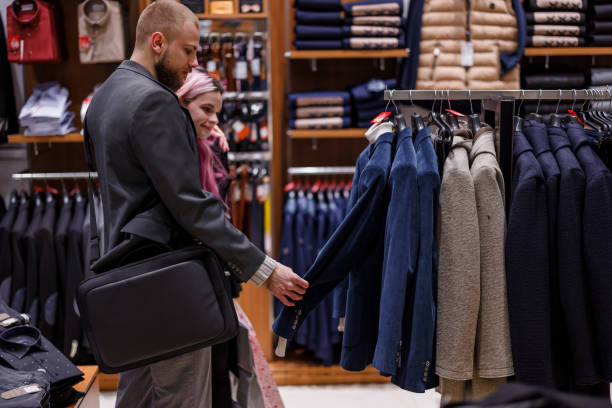 istock A stylish young couple is feeling happy while shopping and choosing clothes. 1471154305