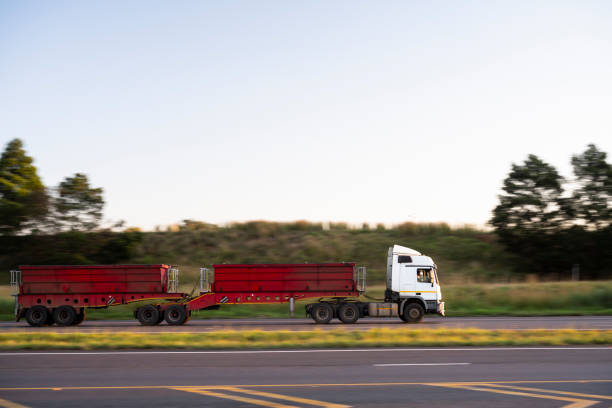 Double trailer tipper trucks transporting coal and other goods on highway