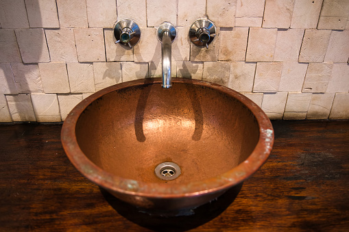 Old copper sink and tap