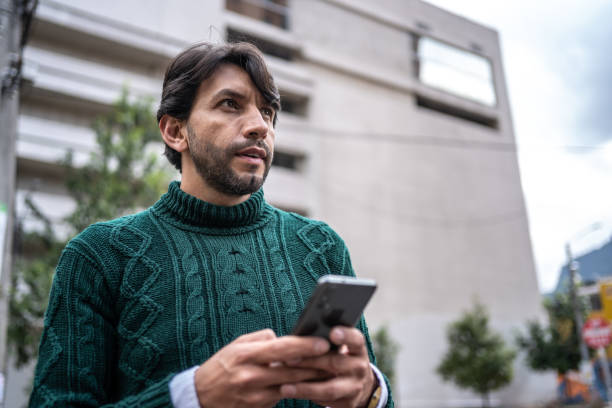 istock Mature man using mobile phone outdoors 1471168194
