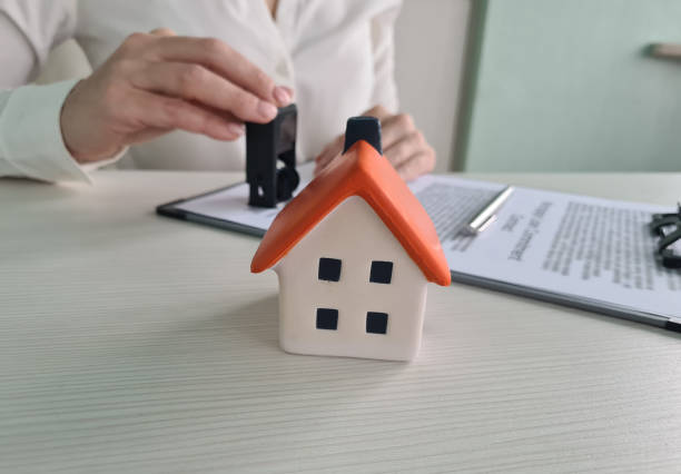 istock Documents deal with house with official seal 1471171676