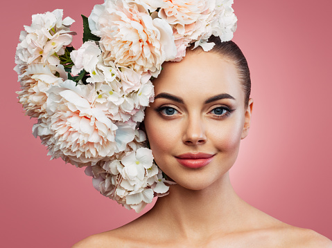 Beautiful emotional woman and bouquet of flowers