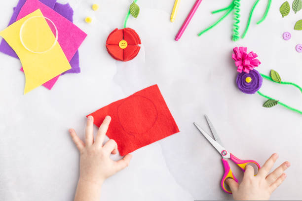 istock Handmade felt flowers craft with kids women's mother's day gift present hands step by step 1471175125
