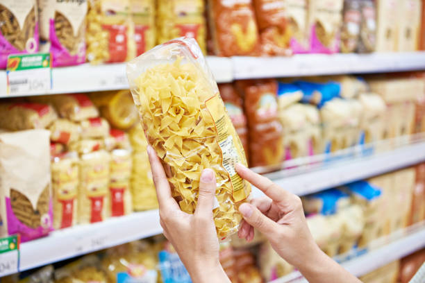 istock Woman with package pasta in shop 1471175164