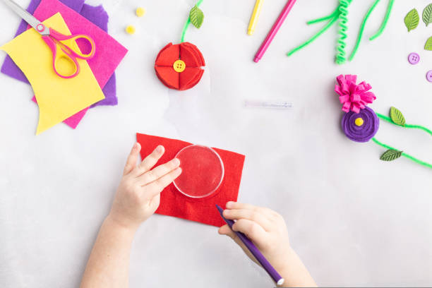 istock Handmade felt flowers craft with kids women's mother's day gift present hands step by step 1471175232