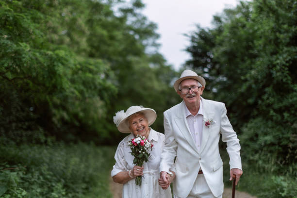 istock Senior couple having marriage in forest during summer day. 1471175364