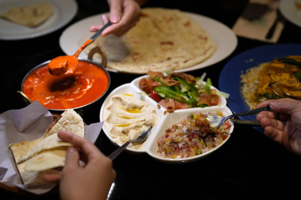 istock Cropped Image Of People Sharing Arabic Food At Table, High Angle View 1471177054