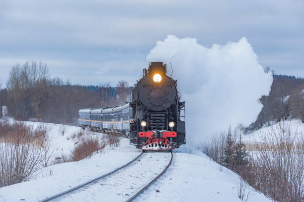 istock Retro steam train moves at winter day. 1471181398