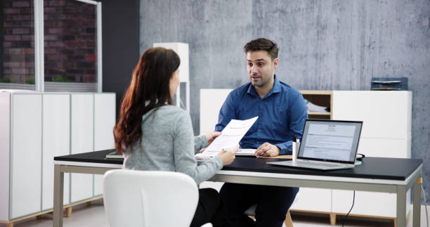 istock Two Businesspeople Talking With Each Other 1471187860