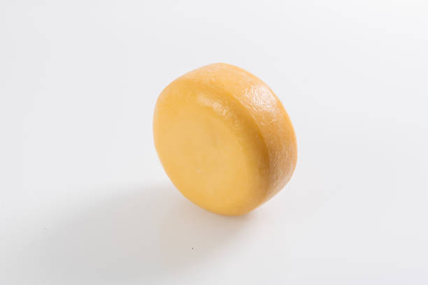 istock A piece of fresh processed cheese isolated on a white background 1471190049