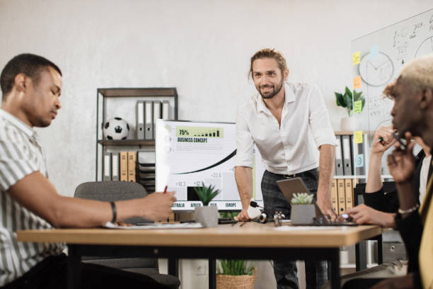 istock Multi ethnic company workers sitting at desk with modern devices, preparing financial report 1471191291