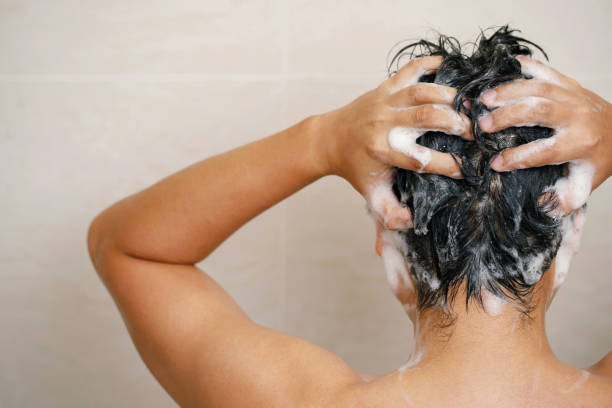 istock A man is washing his hair with shampoo 1471195663