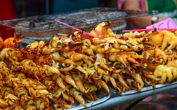 istock Grilled squid at street market 1471196689