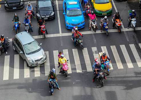Bangkok, Thailand - Jun 17, 2016. Vehicles stop on street of Bangkok, Thailand. Bangkok is the heart of the country investment and development.