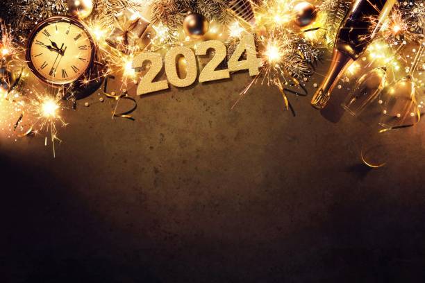 New Year 2024 holiday background with clock, christmas balls, champagne bottle, gift box and lights stock photo