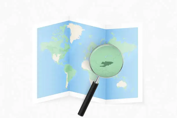 Vector illustration of Enlarge Kyrgyzstan with a magnifying glass on a folded map of the world.