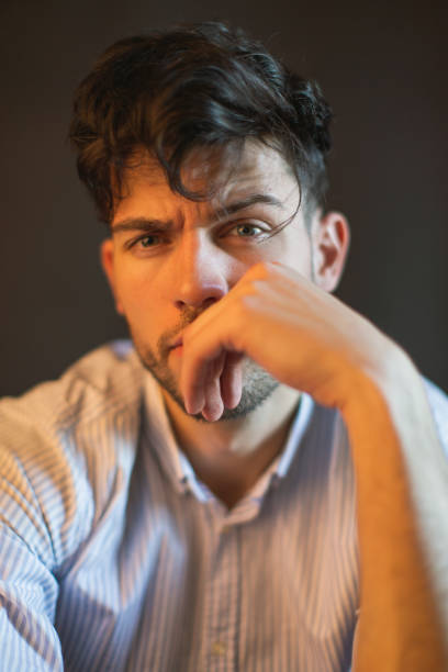 istock Brunette man in shirt in studio on black background 1471203910