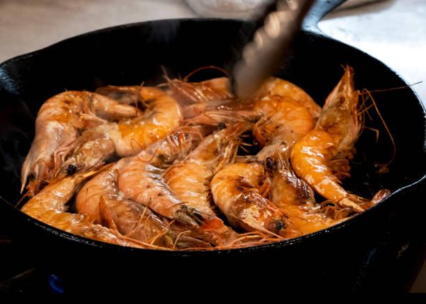 istock Whole Prawns Cooking in Cast Iron Pan 1471204304