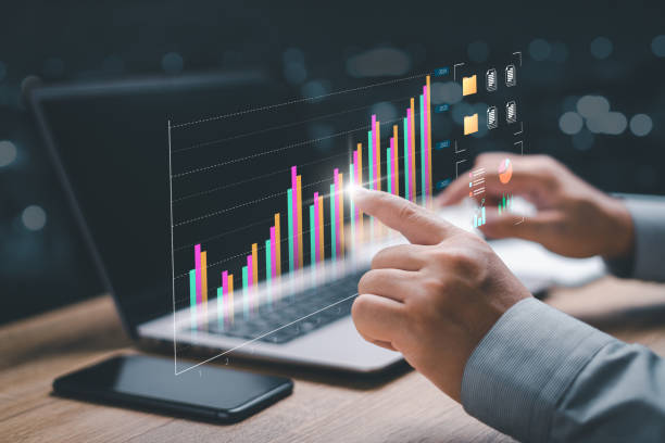 istock Business strategy concept, automated operations, customer service, data management financial analytics, Businessman analysis market data, and planning by comparing data from graphs 1471206949