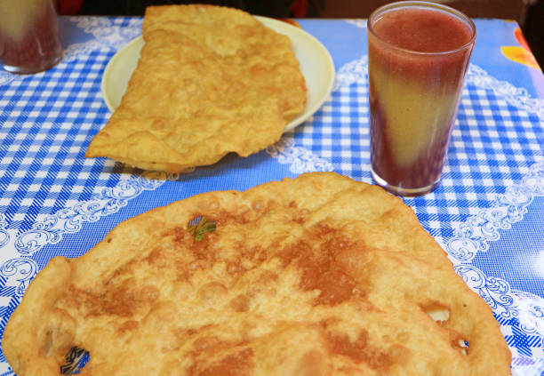 istock Bolivian Bunuelos Fried Dough with Api Morado, Beverage Made from Purple Corn 1471207002
