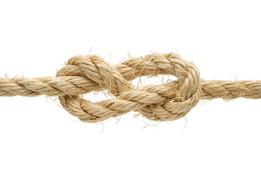 Sailor stopper knot made of rough hemp rope, isolated on white background