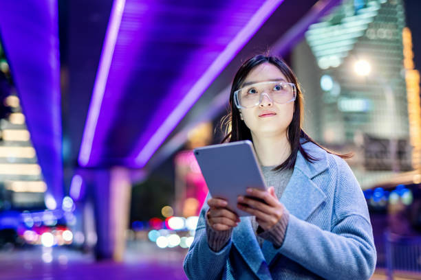 istock Young asian woman using mobile phone at night 1471212843