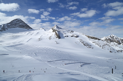 Enchanting mountains in Austria - Hintertux. Skiers have fun on the beautiful slope