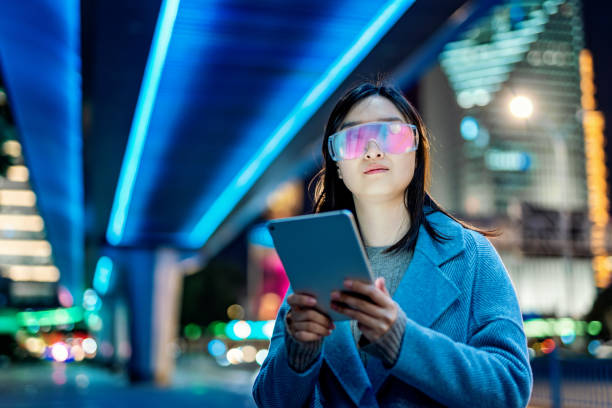 istock Young asian woman using mobile phone at night 1471215956