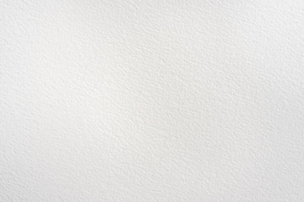 A top-down view of 100% cotton handmade Fabriano paper, showcasing its organic texture against a clean white background. The raw, unbleached fibers create a natural aesthetic, perfect for eco-conscious branding and stationery design.