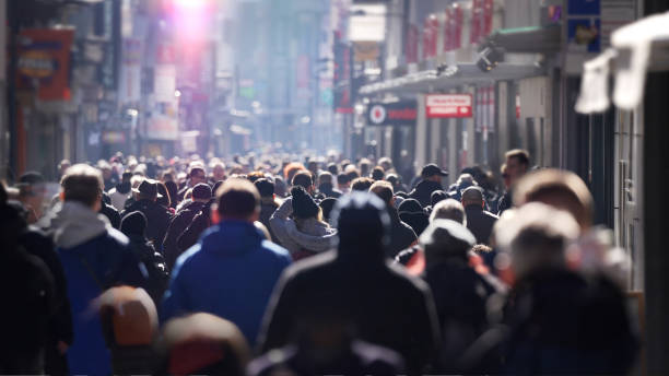 istock Busy high street, people walking in a dense crowd 1471227712