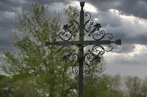 Wrought iron cross in a cemetery