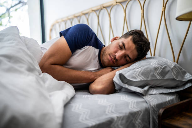 istock Young man sleeping in the bedroom at home 1471232619